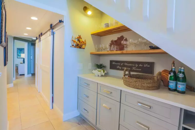 The first floor bedroom is located just down the hall from the kitchen and butler pantry.