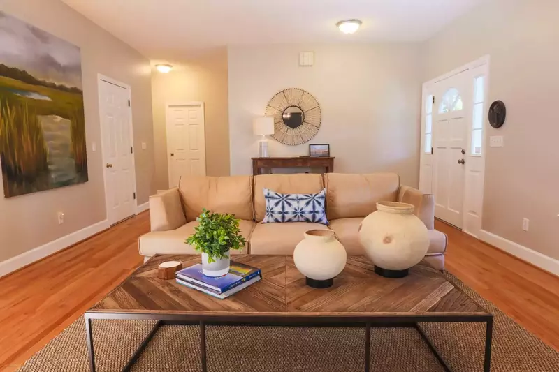When you enter the front door, you'll find a comfortable living room with hardwood floors.