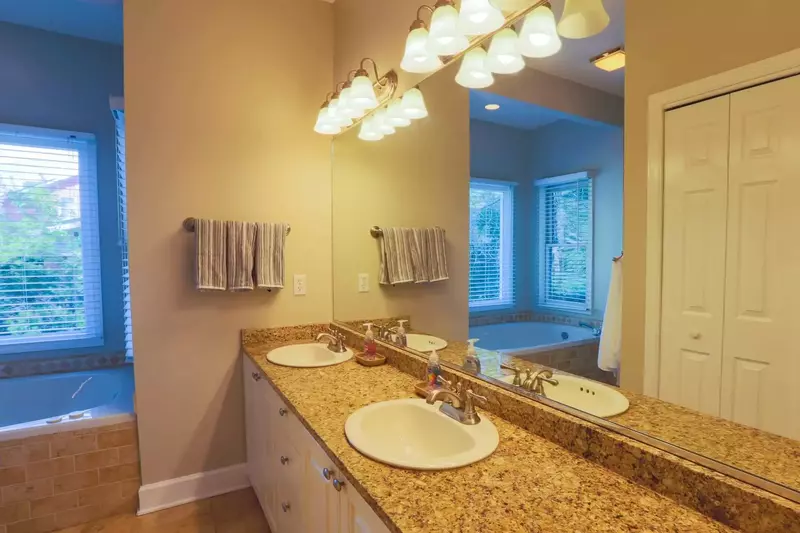 The en suite bathroom in the master bedroom has a double sink vanity and soaking tub.