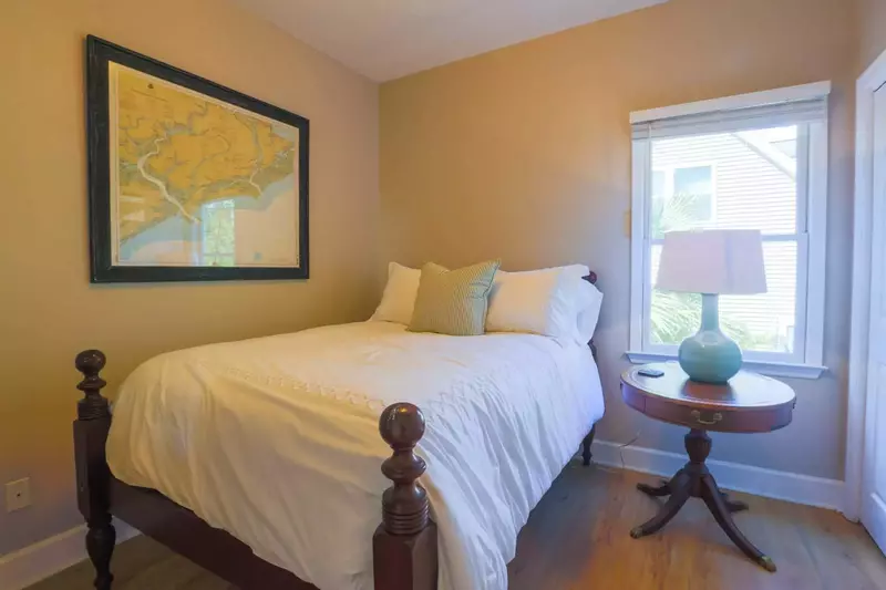 This guest bedroom, which is also on the first floor of the home, features a full size bed.