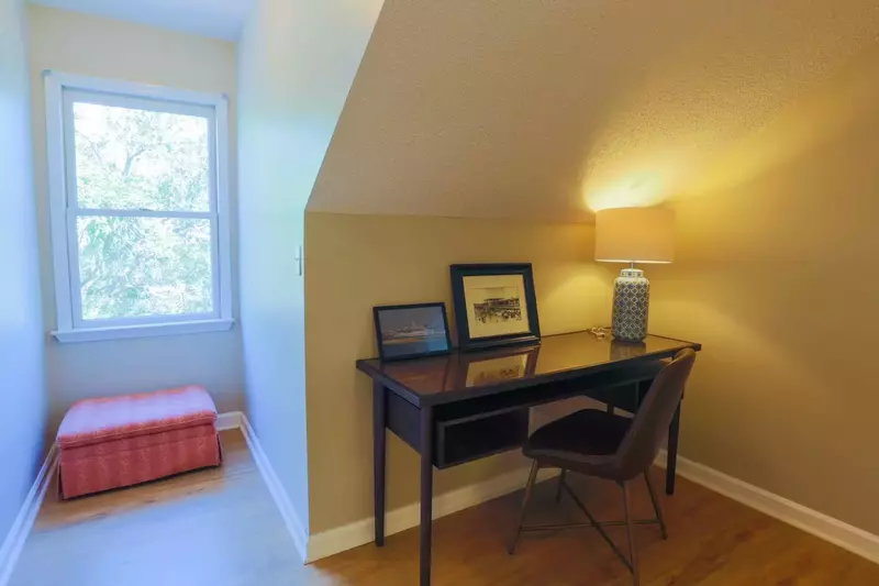 There's a small desk area that separates the two bedrooms and full bathroom on the second floor.