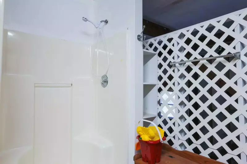 Rinse away the sand from the beach or bathe your dog in the shower in the garage.