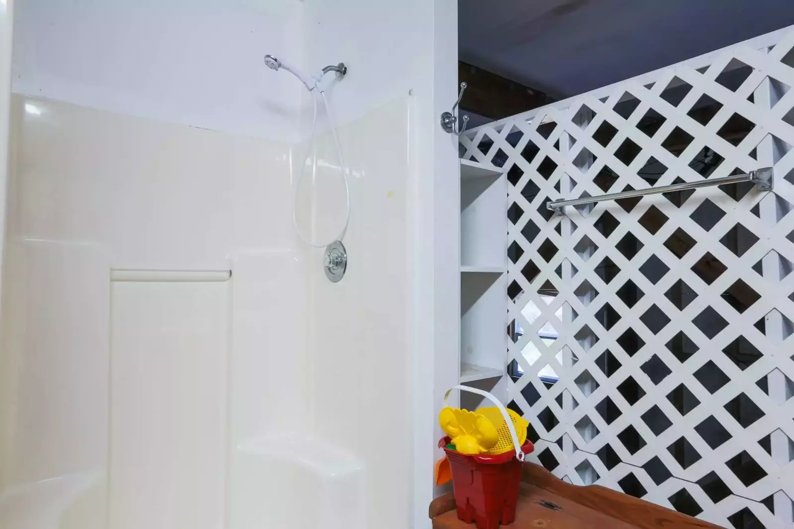 Rinse away the sand from the beach or bathe your dog in the shower in the garage.