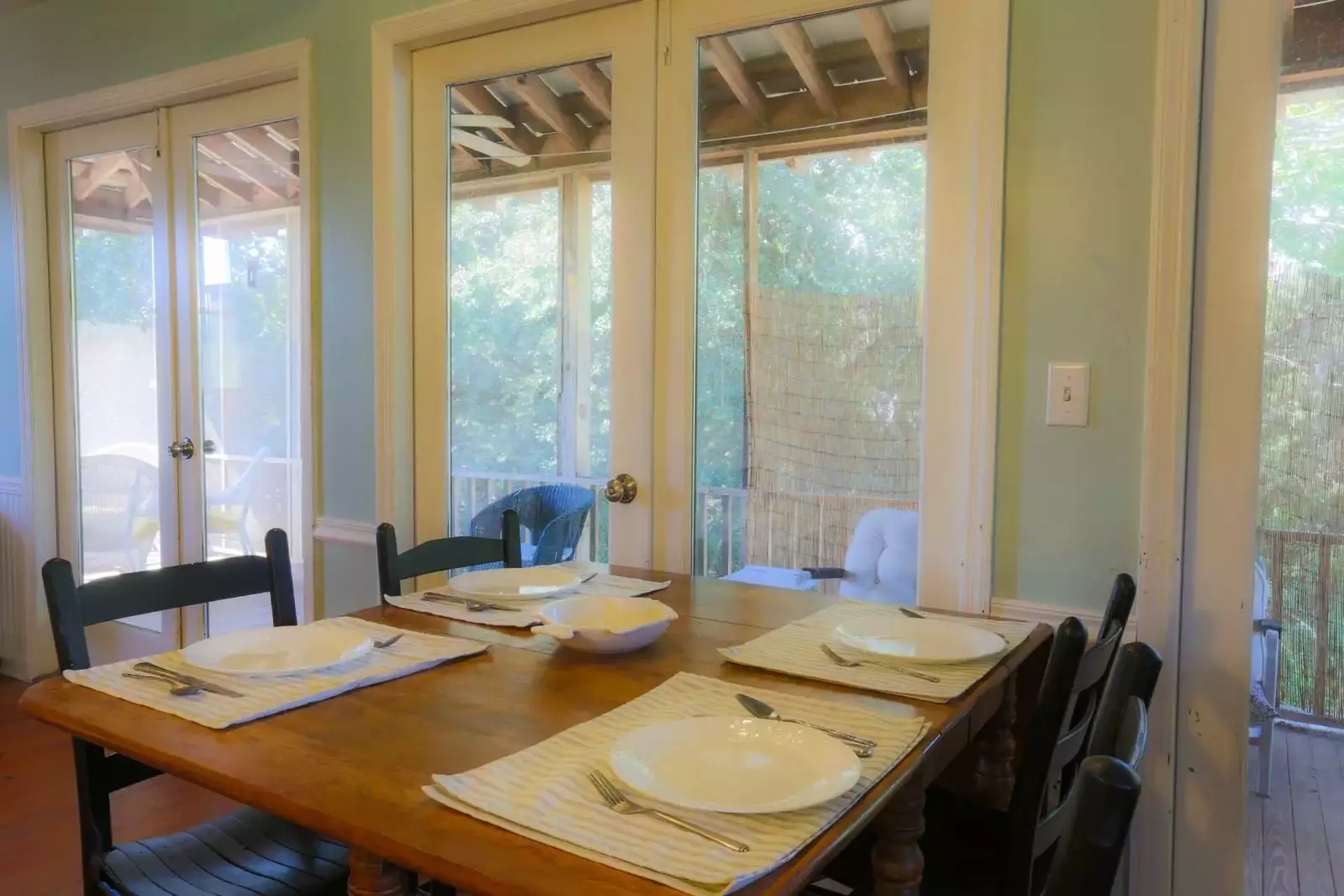 There are three dining tables in the home -- 1 in the kitchen and 2 on the screened-in porch.