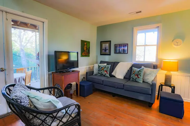 You'll find the seating area (with new sofa!) and smart TV sit just off the kitchen area.