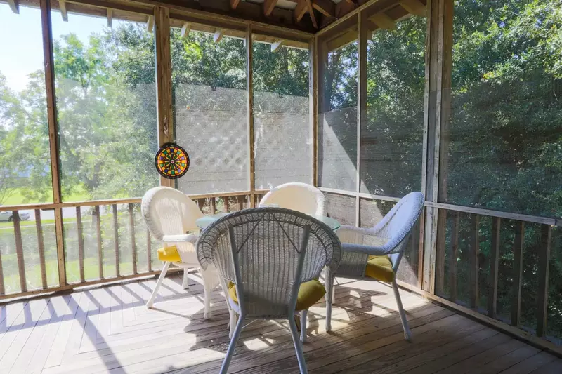There are two outdoor tables on the screeened-in porch.  Each table seats 4 people.