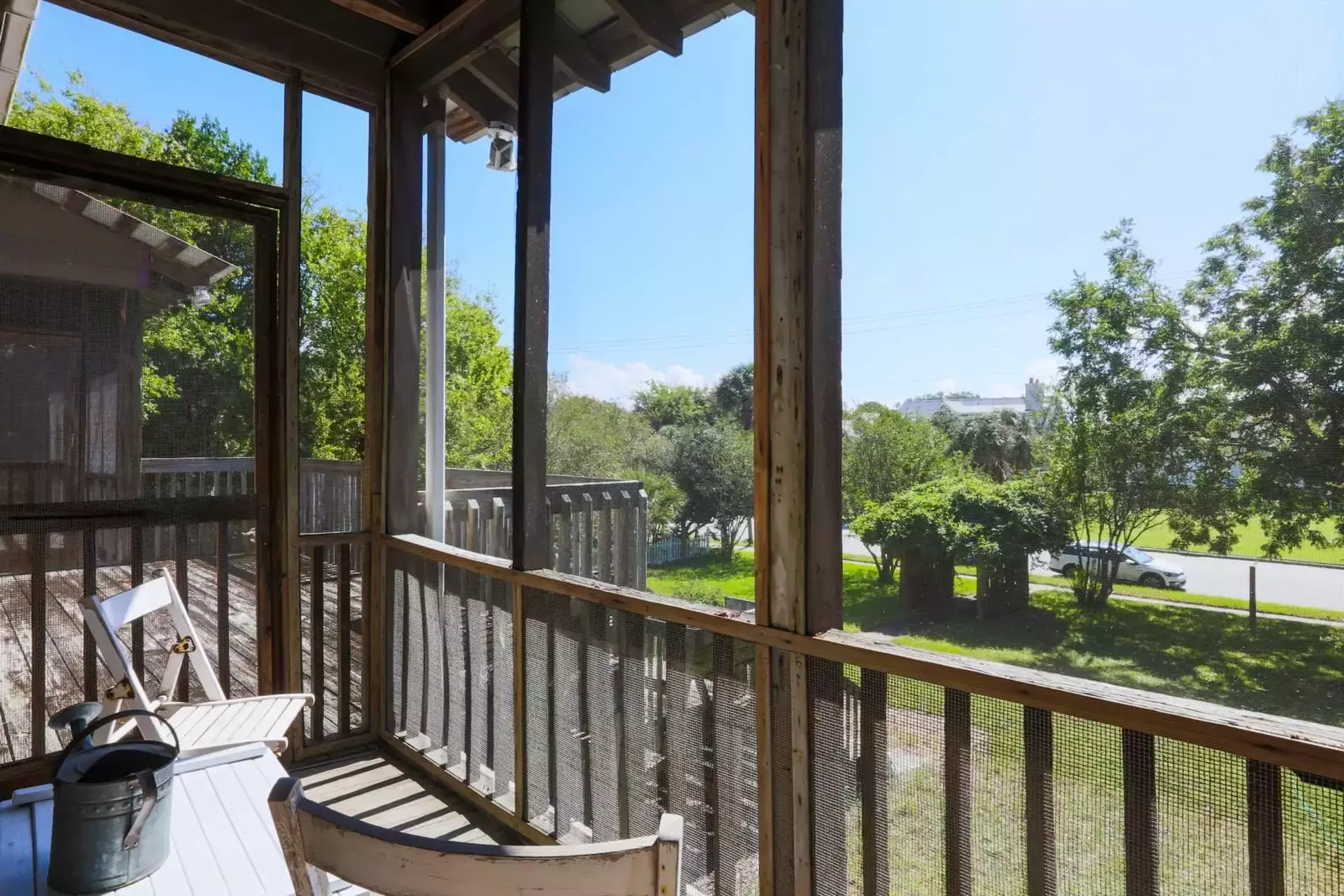 This screen door connects the screened-in porch to the front porch.