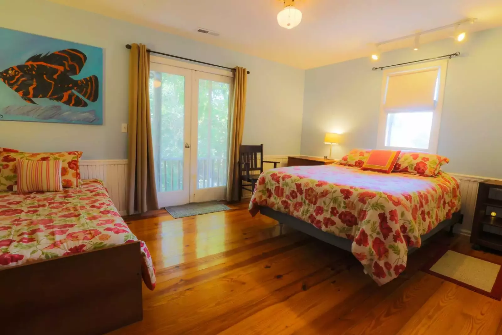The front bedroon has a queen bed and twin bed.