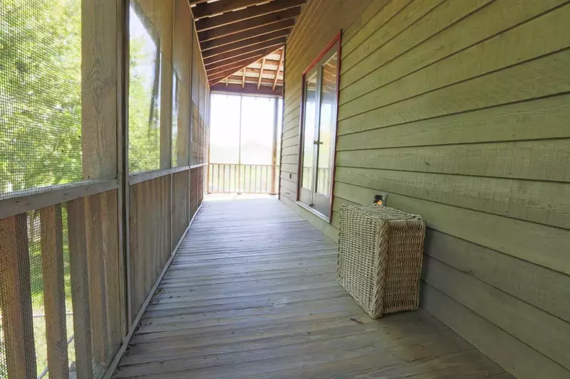 This screened-in porch runs along the bedroom side of the house.