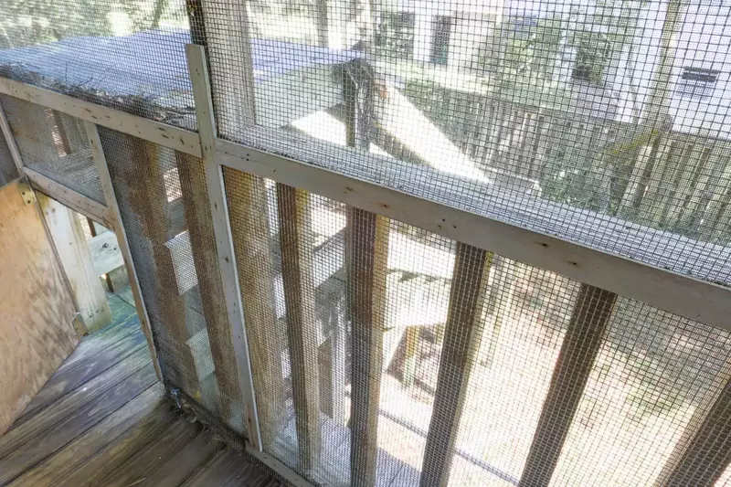 There is a doggy door on the upstairs screened-in porch that leads down to the fenced dog run.