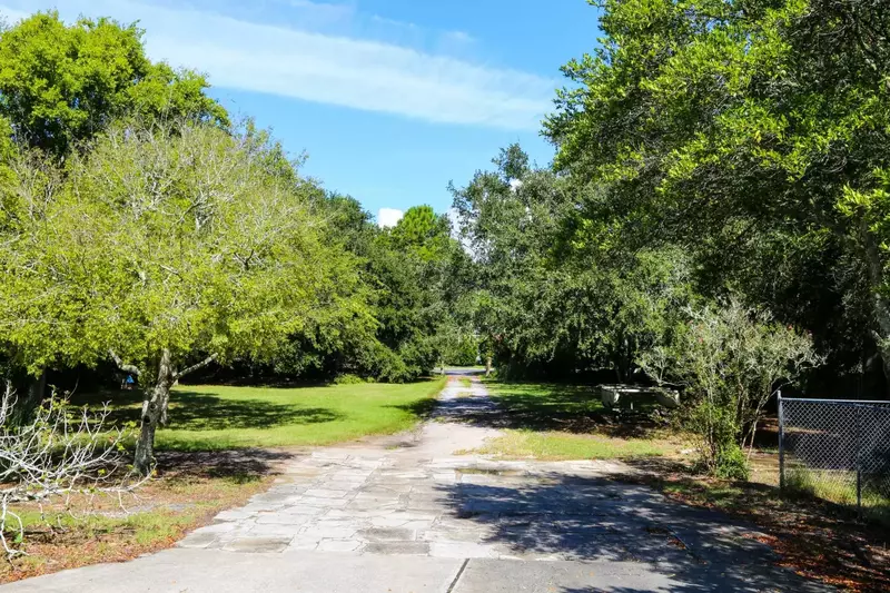 The driveway connects the back of the home to Jasper Blvd.