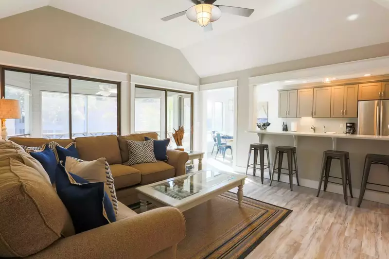 The living room opens into the kitchen and dining areas.