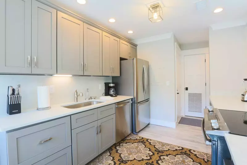 There's plenty of counter space and cabinet storage area for your food & kitchen items.