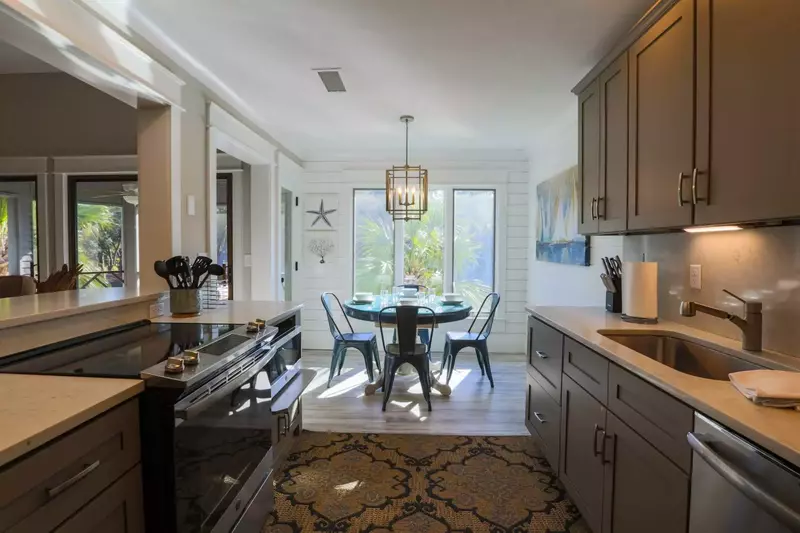 The galley style kitchen opens onto the dining area.