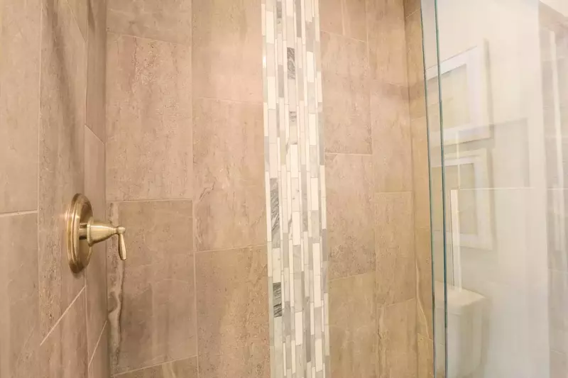 You'll love the beautiful tile in the master bathroom's walk-in shower.