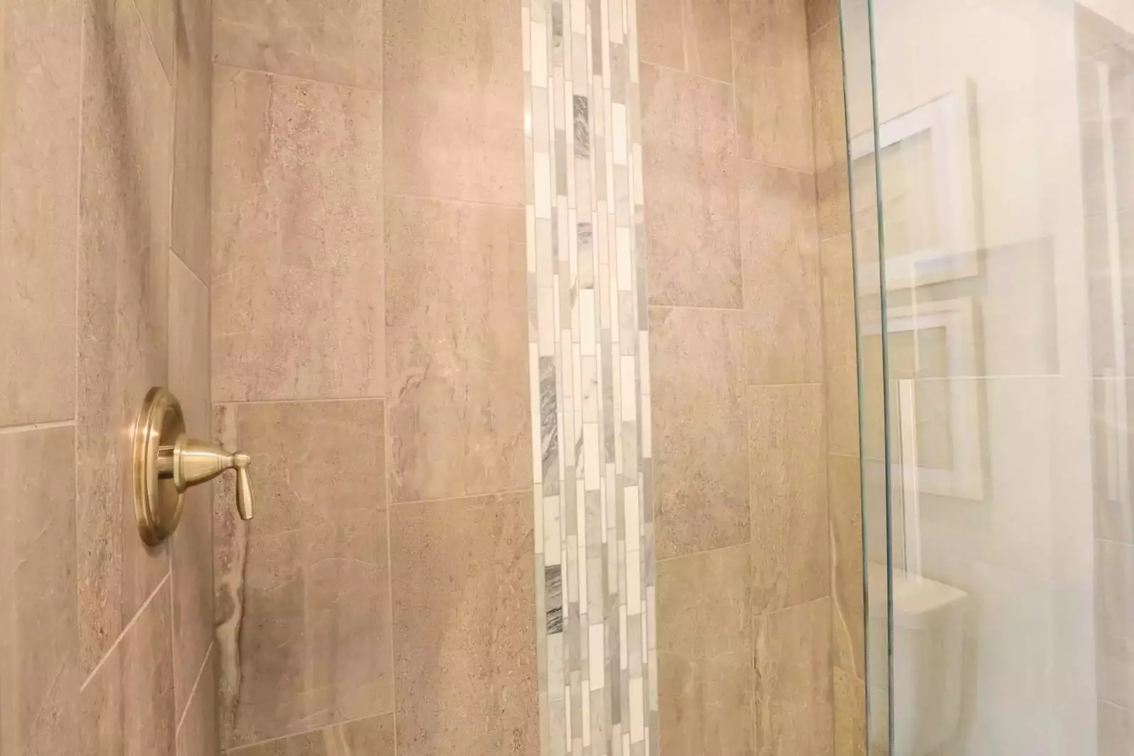 You'll love the beautiful tile in the master bathroom's walk-in shower.