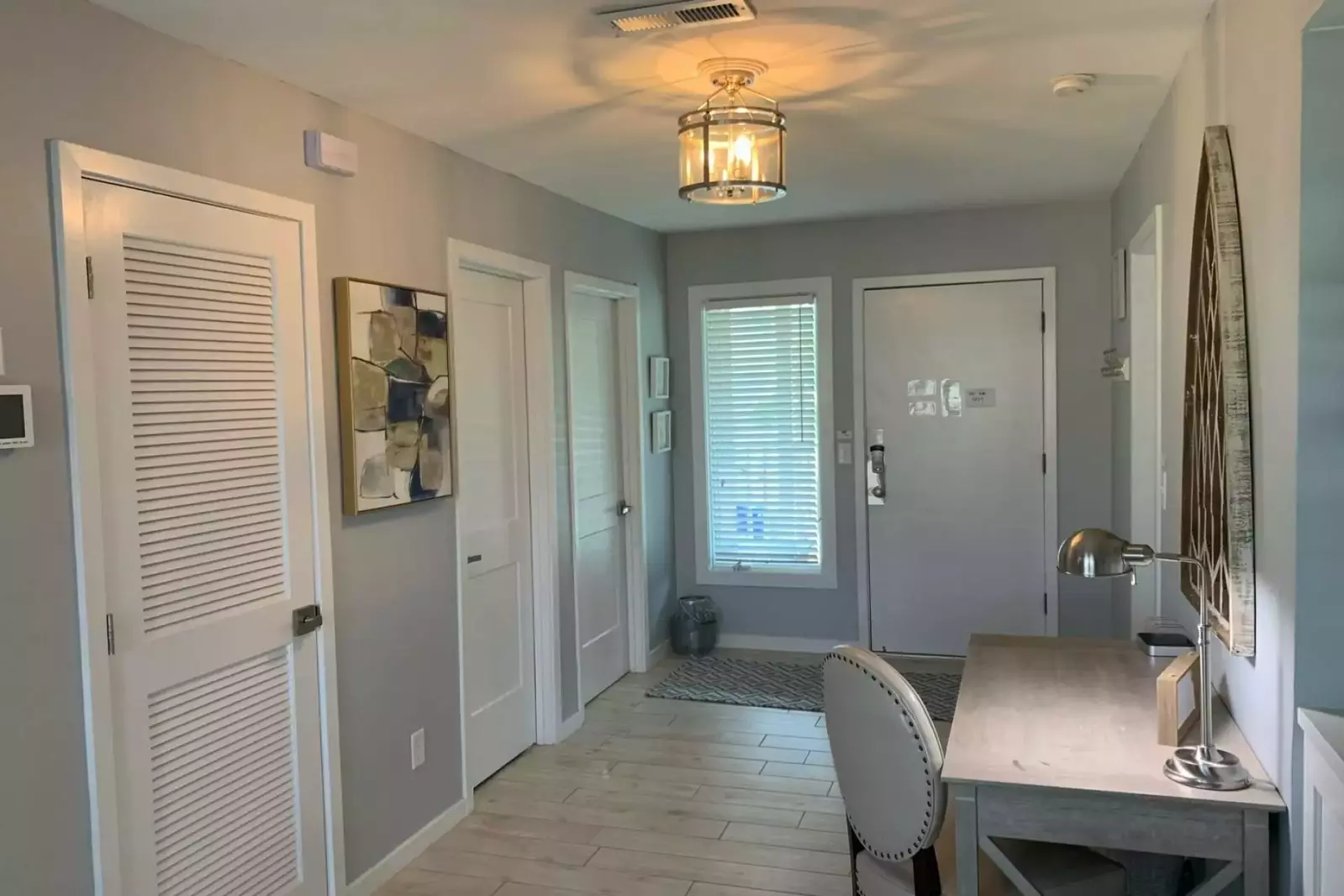 This hallway connects the kitchen & living room on one side of the hall with the bedrooms on the other side of the hall.