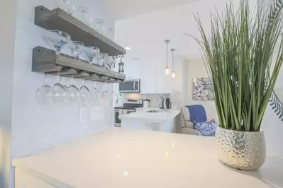 This is the view of the kitchen and living room from the central hallway.