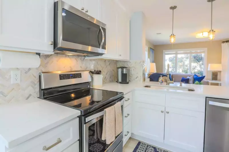 The renovated kitchen is fully stocked for your stay.