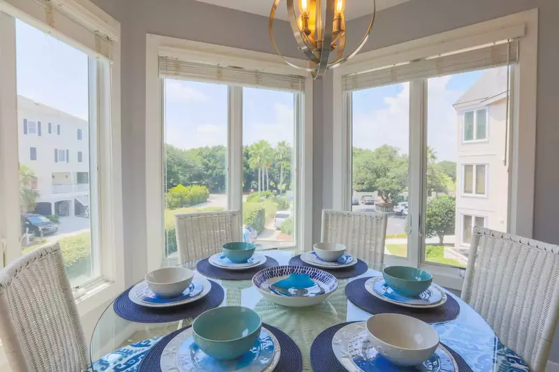 There are enough chairs and table settings to comfortably seat 6 people at the dining table.