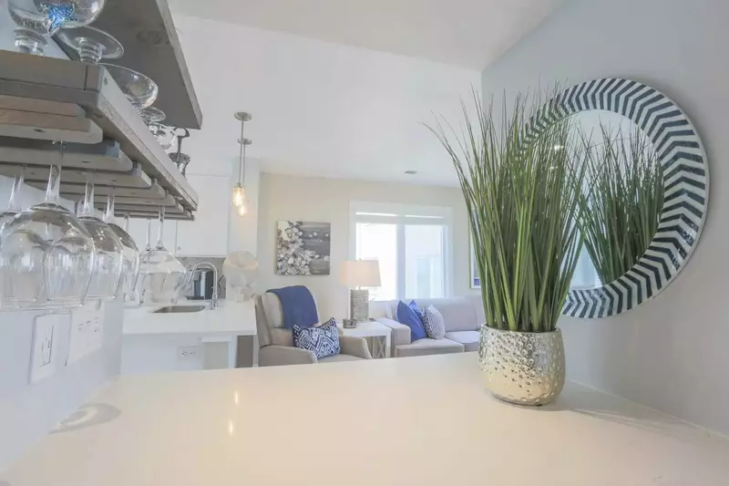 The butler's pantry near the kitchen & living room looks out on the central hallway.