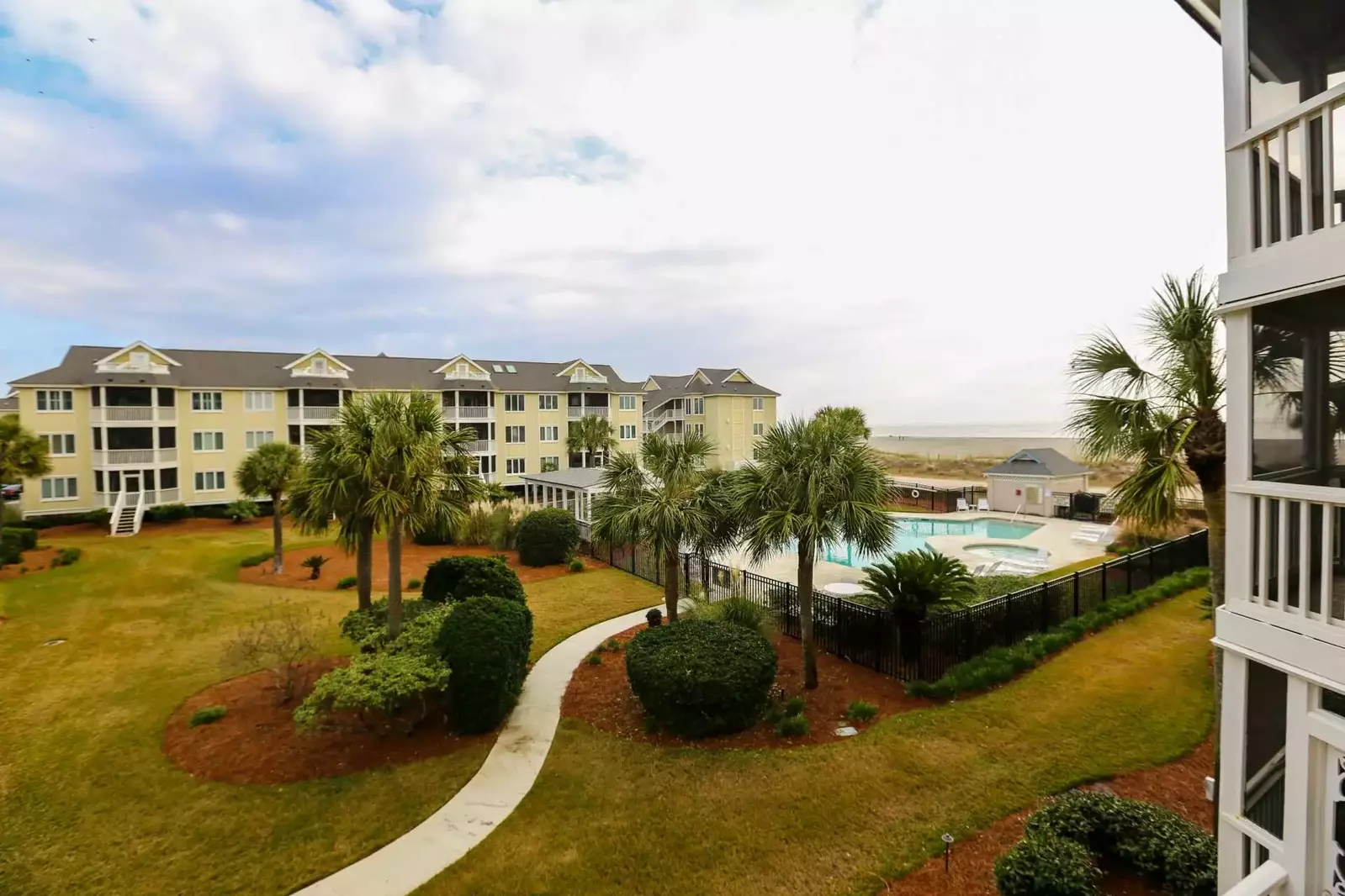 This is the view of the community pool and Atlantic Ocean from the master bedroom.