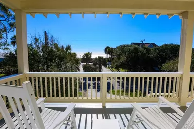 Enjoy your morning coffee or happy hour cocktail in one of the rocking chairs on our front porch.