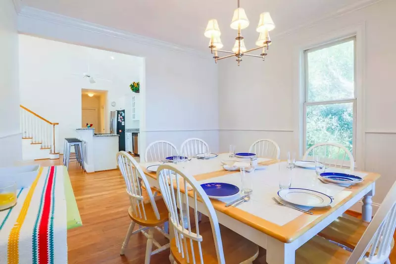 It is a short walk from the dining room to the kitchen area.