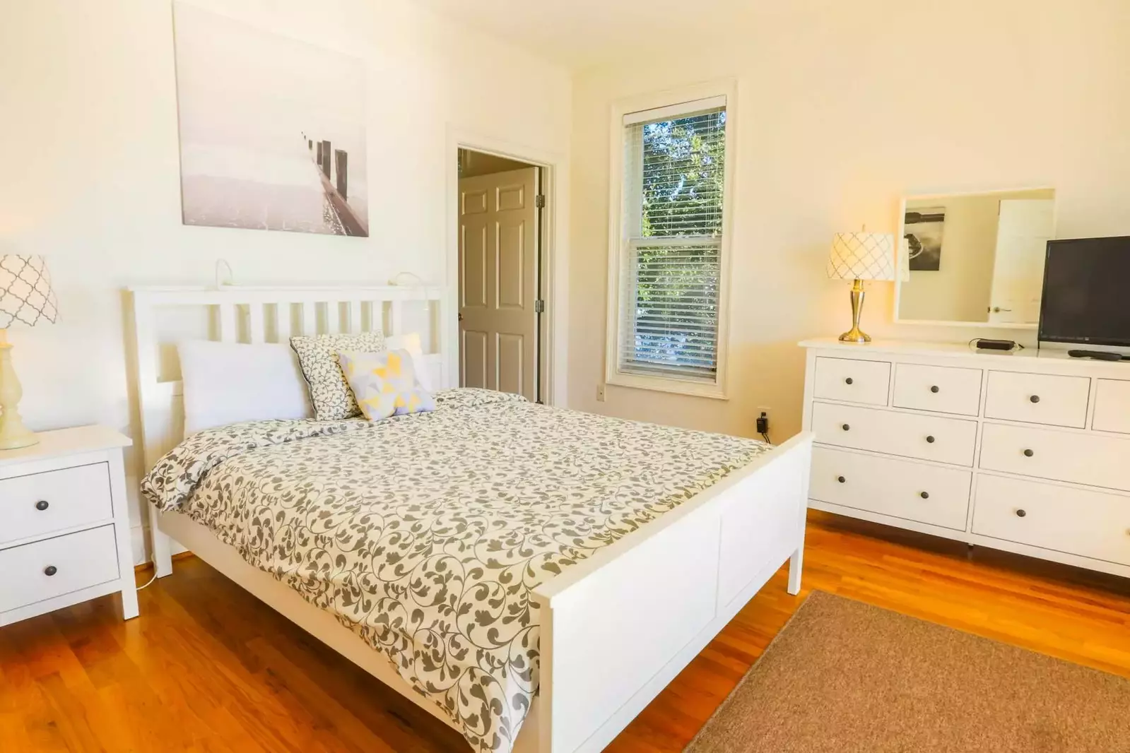 This bedroom also has a queen size bed, nightstand with reading lamp, dresser and cable TV.