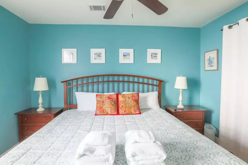 The freshly painted bedroom walls will remind you that you are on a beach vacation.