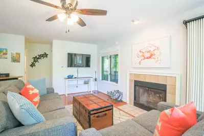 When you enter the home, you'll find the living room with new sofas and a wall-mounted smart TV.