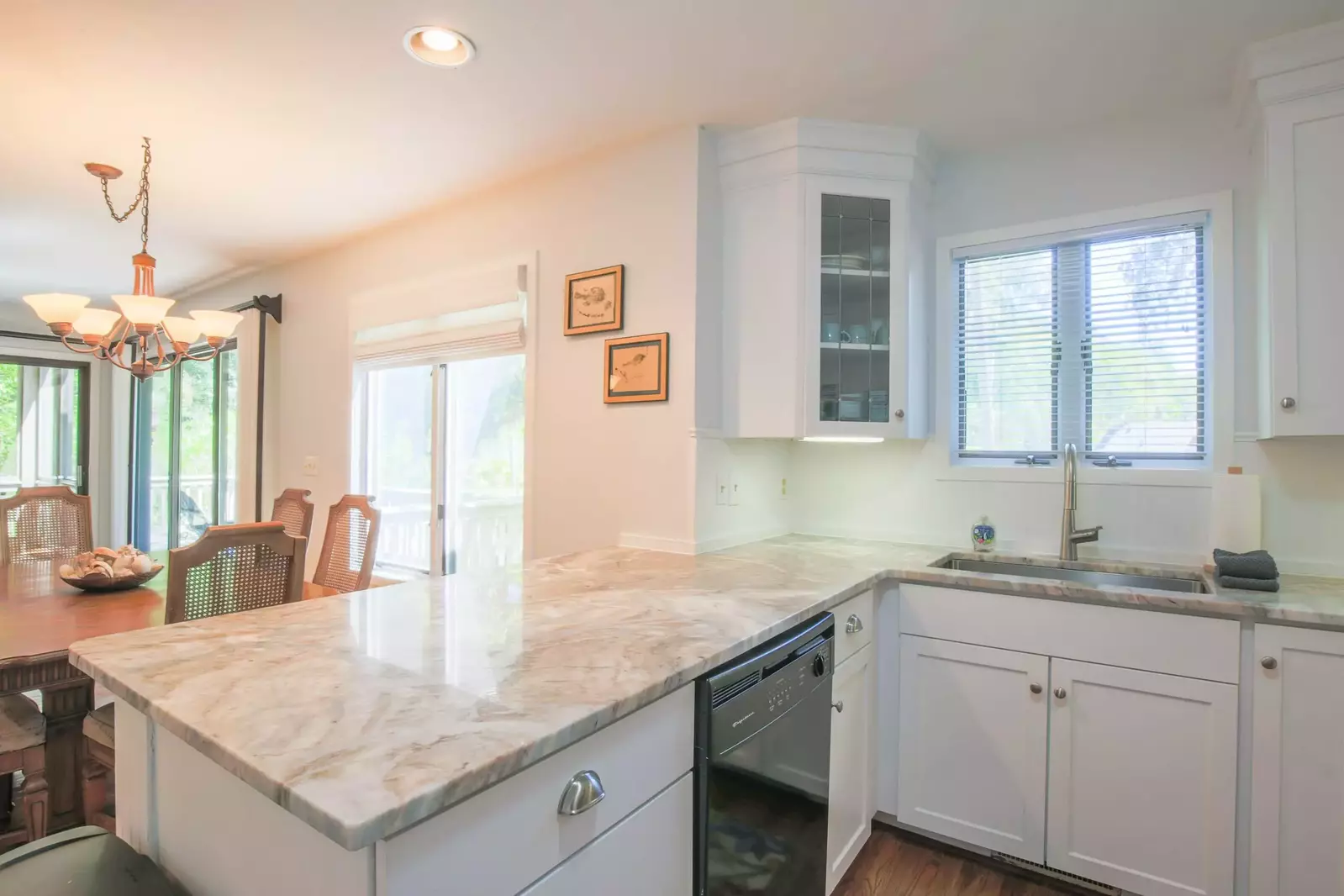 There's an open floor plan layout between the kitchen, dining room and living room areas.