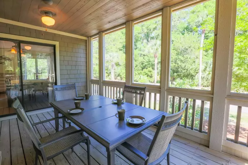 There is also an outdoor dining table on the screened porch.
