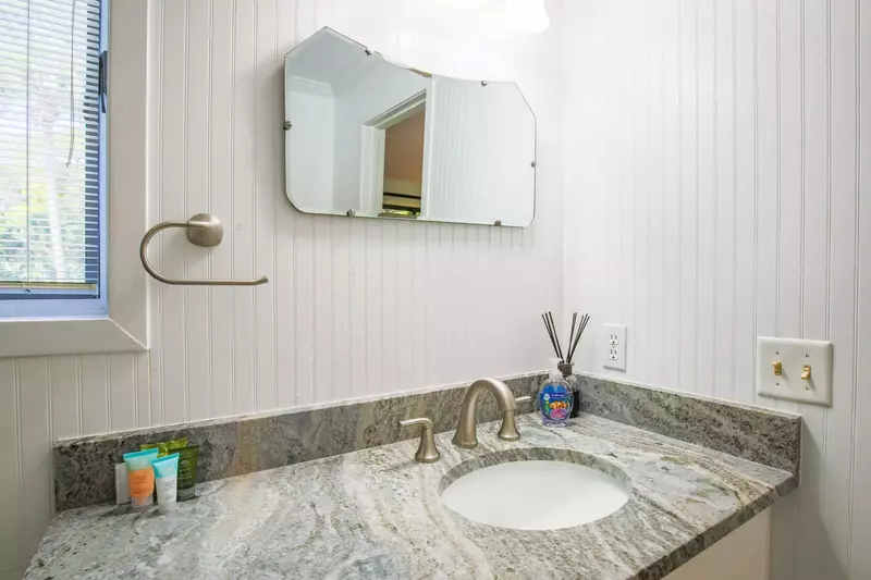 The master bathroom features a spacious vanity.