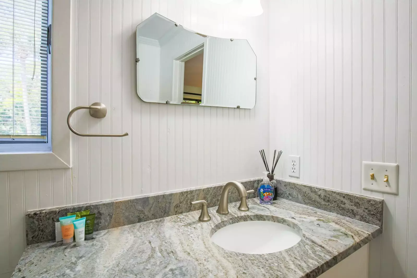 The master bathroom features a spacious vanity.