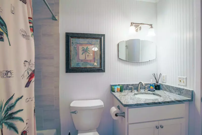 This bathroom is accessible from both the hallway and the guest bedroom.