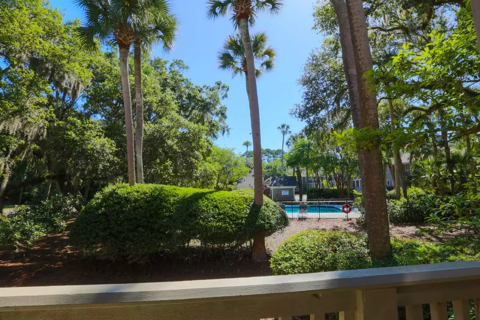 You can view the community pool from the partially covered deck.