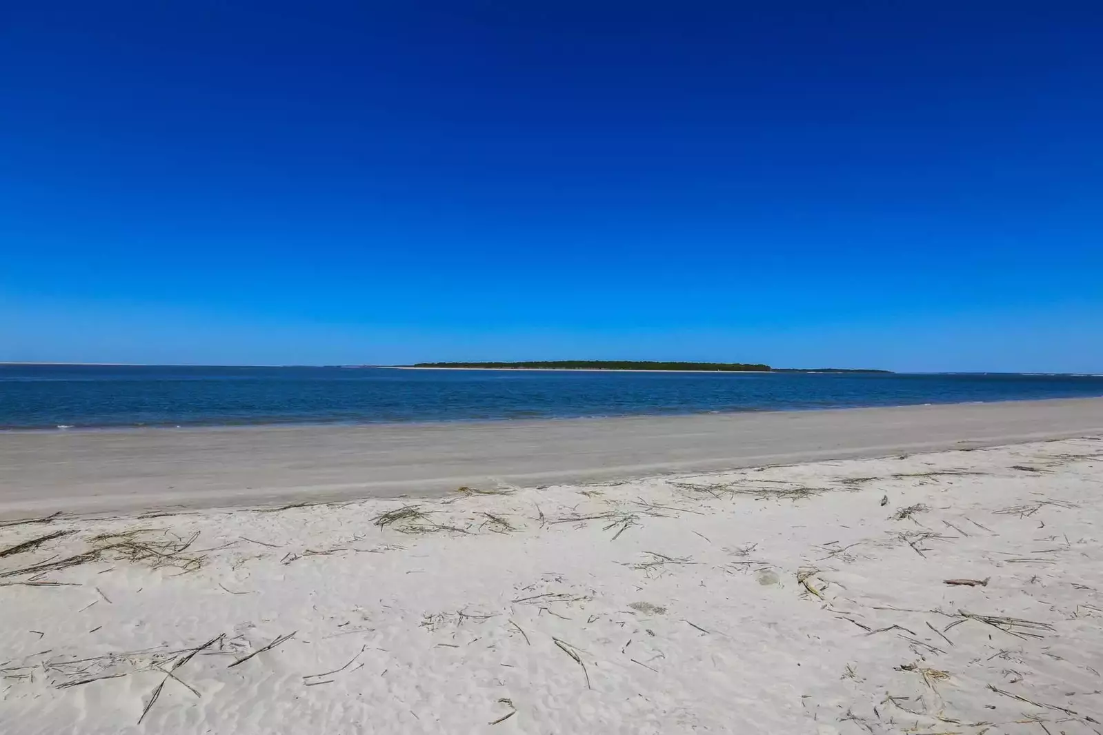 This quiet, white sandy beach could be all yours!