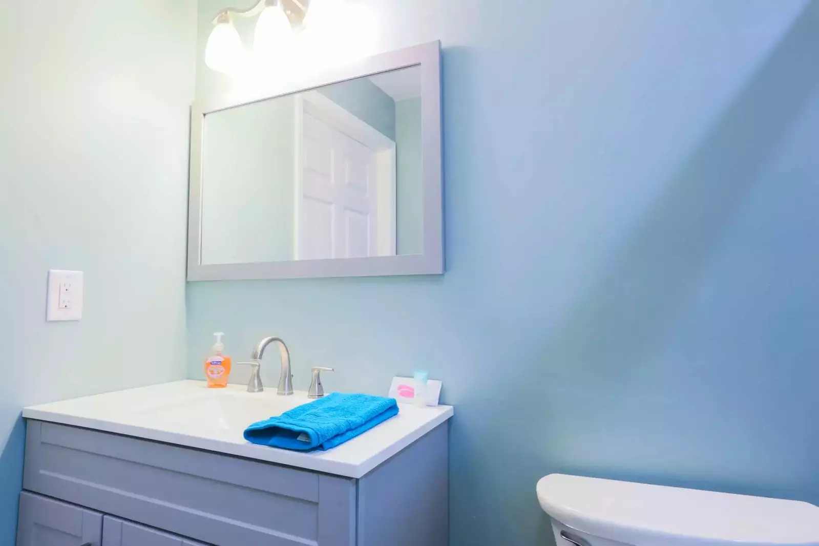 The bathroom also has a vanity with both countertop & cabinet storage for your personal items.