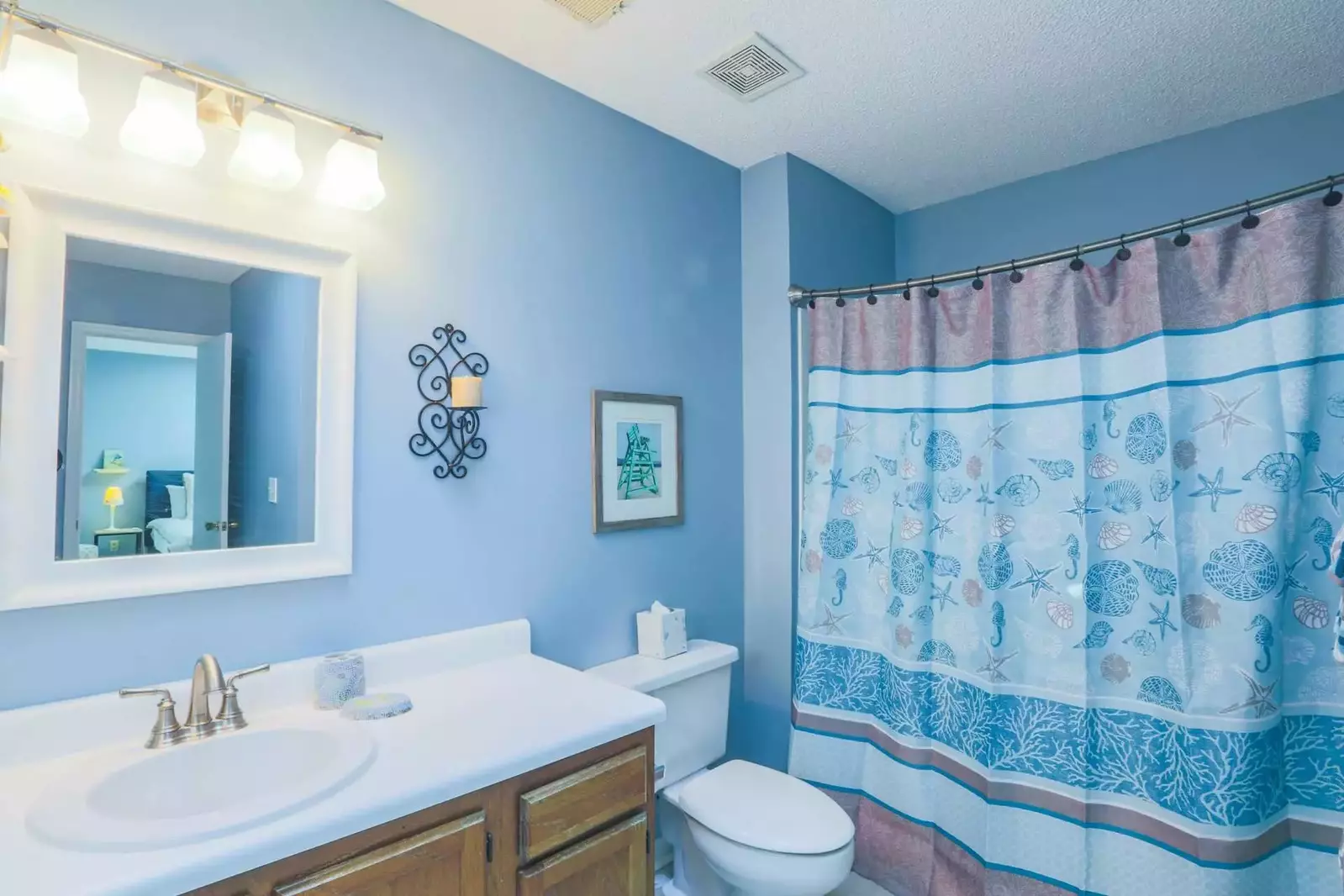 The master bathroom has a shower/tub combo and large, spacious vanity.