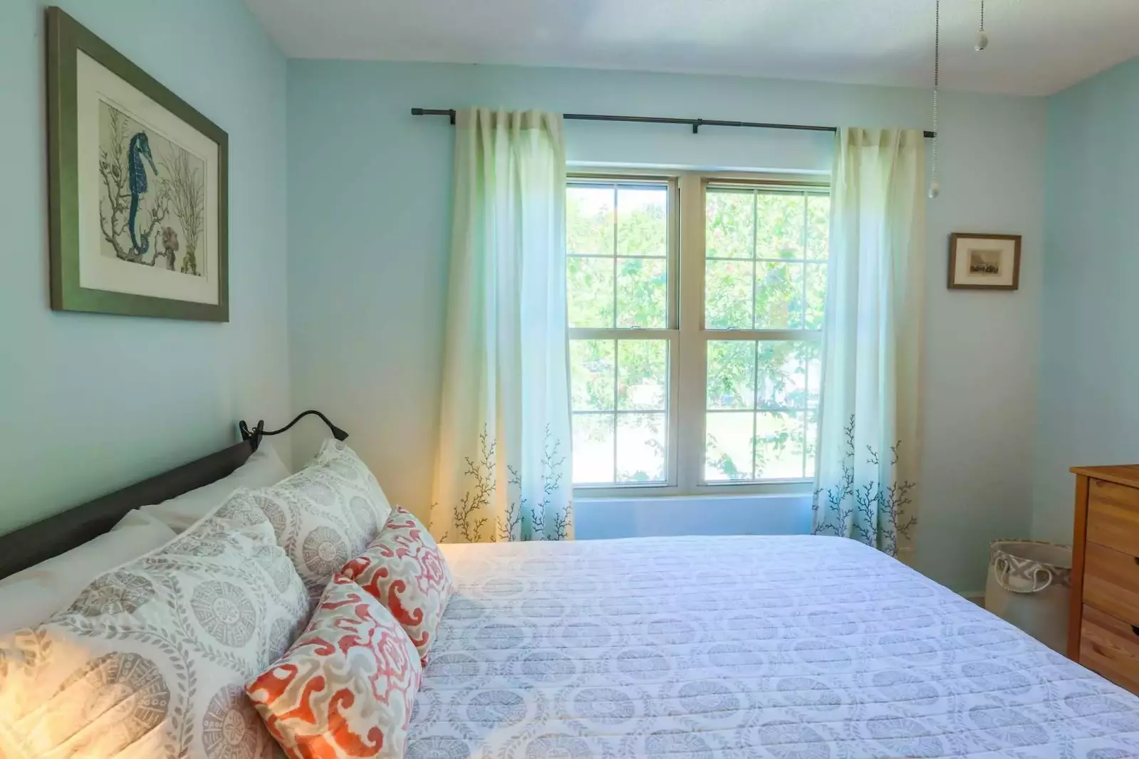 This bedroom gets wonderful natural light from the double windows that overlook the front yard.