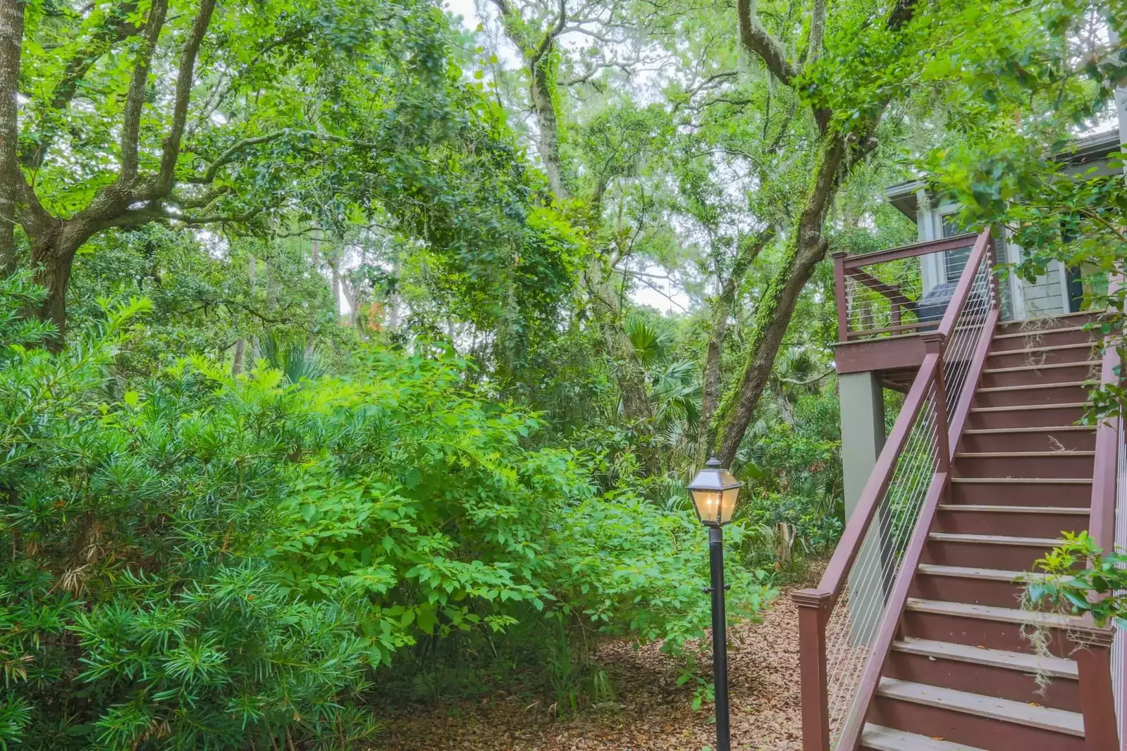 There is also an exterior staircase that leads to the back deck and BBQ grill.