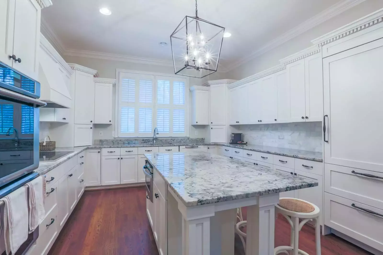 Built-in cabintry conceals the refrigerator, freezer and dishwasher.