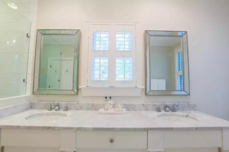 Marble countertops adorn the his & her sinks and vanities in the master bathroom.