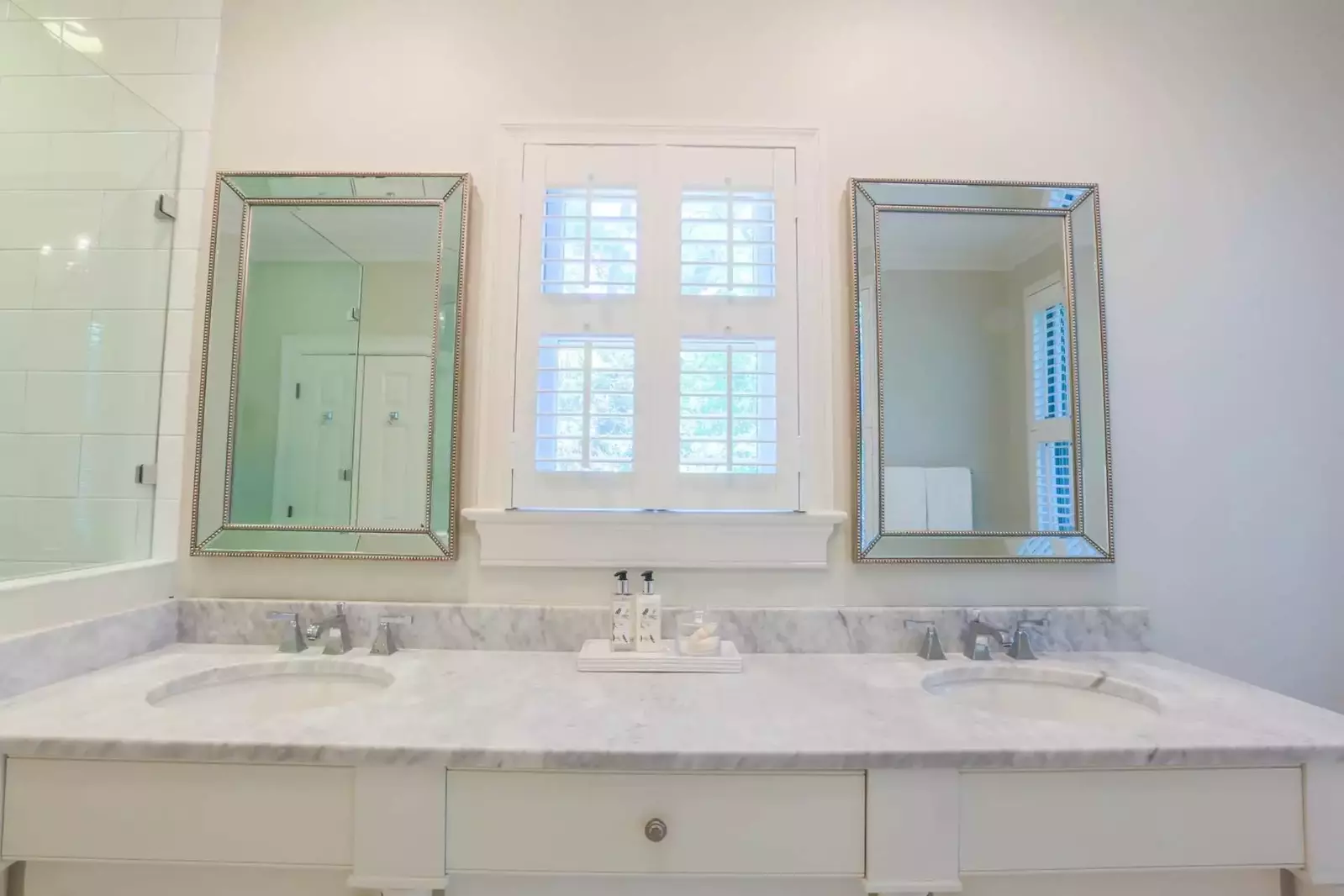 Marble countertops adorn the his & her sinks and vanities in the master bathroom.