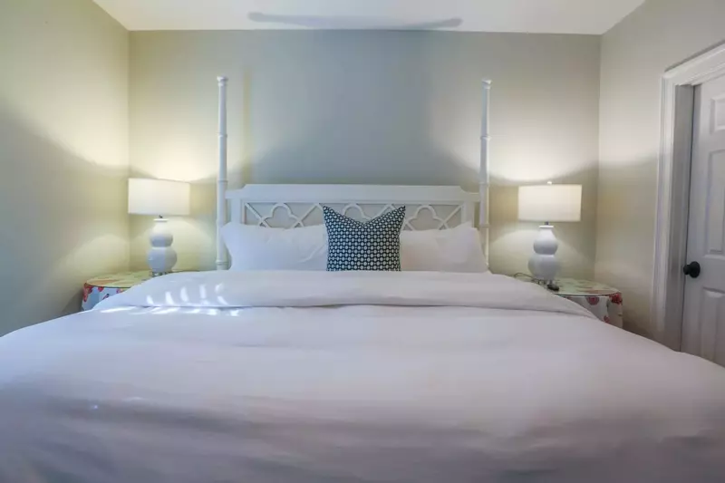 This guest bedroom also has an en suite bathroom through the door on the right in this photo.
