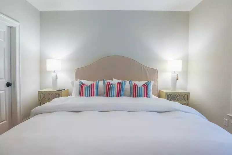 This guest bedroom also has an en suite bathroom through the door on the left in this photo.