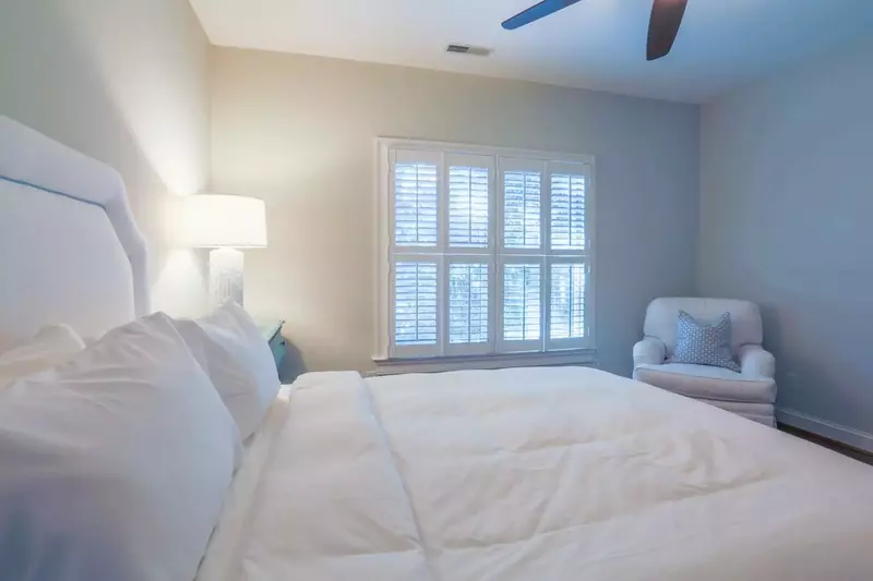 This guest bedroom looks out over the front side of the home.