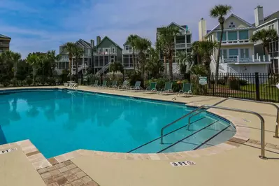 The Ocean Point community pool has a large sundeck with sun loungers.