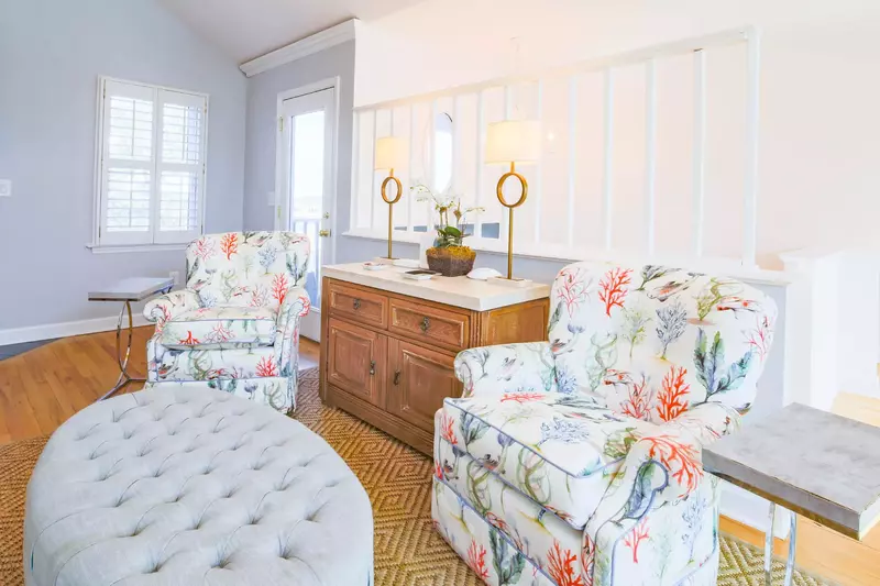 The door on the left leads to the screened porch, which overlooks the lagoon behind the home.